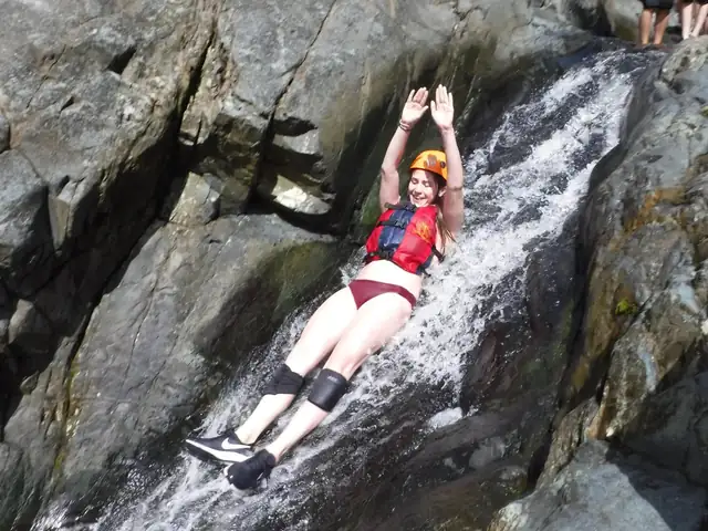 Natural rock waterslide with rushing water in El Yunque